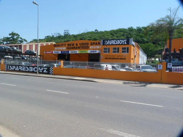 The orange SparesBoyz building on Chris Hani Road, Briardene, with a brand strip that includes Land Rover and a sign reading Independent Importer, Non Authorised Dealer